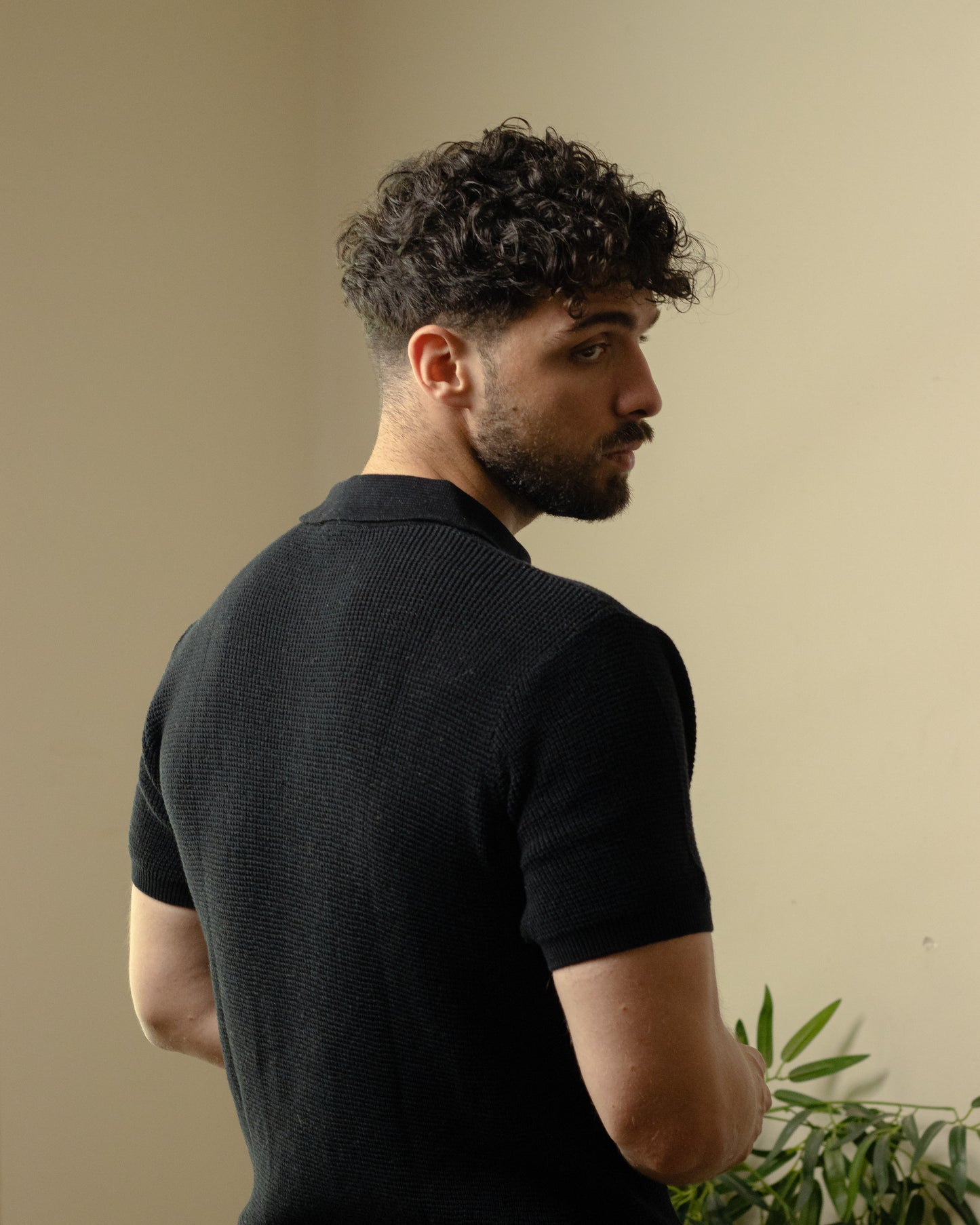 Unisex black knitted polo