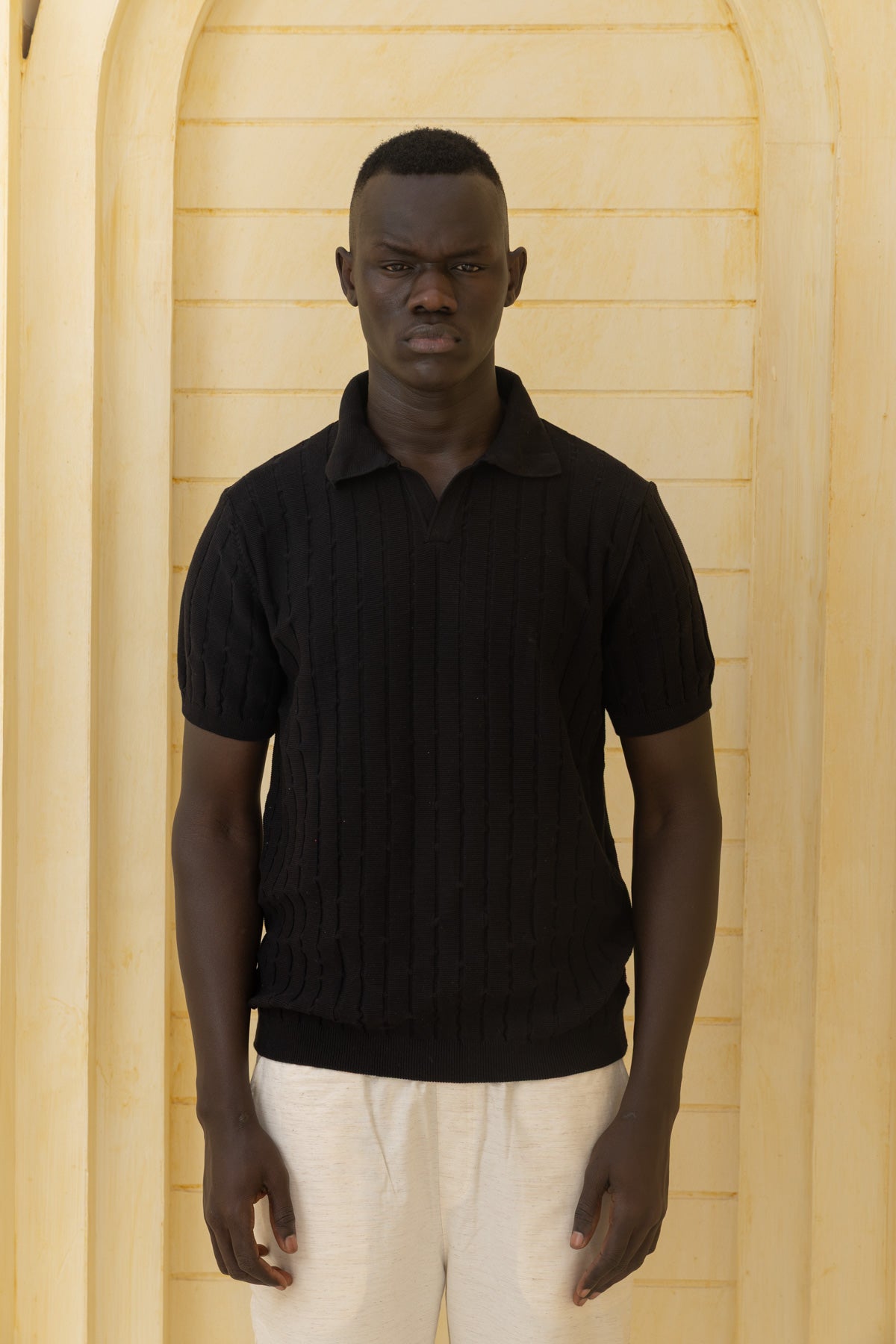 Unisex black knitted polo