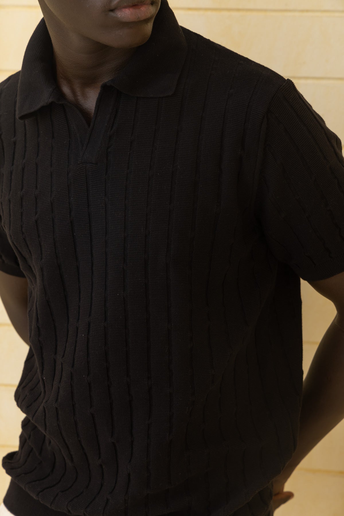 Unisex black knitted polo